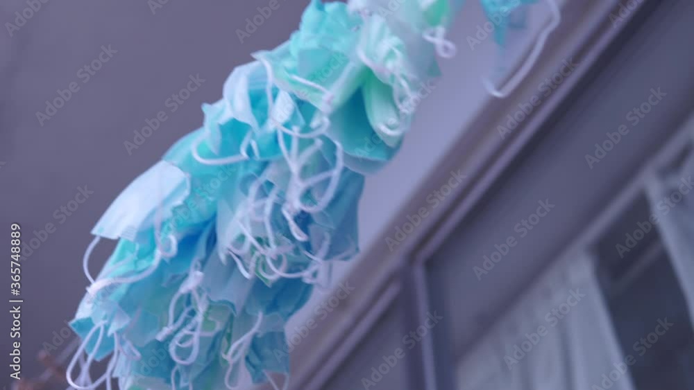 Hanging disposable masks hanging outside for disinfection and