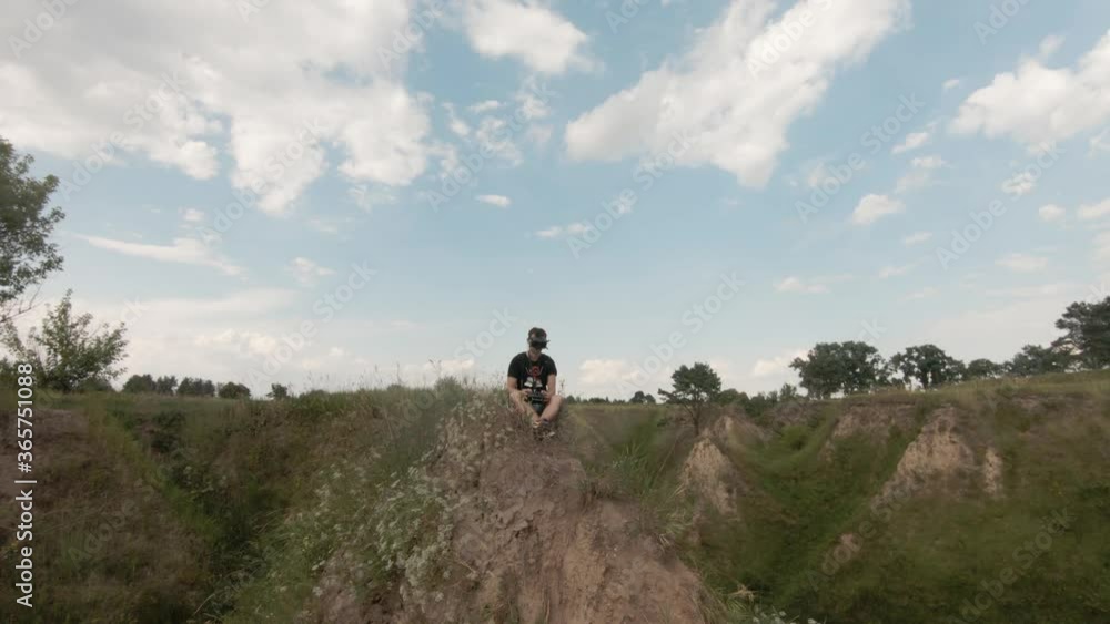 Cinematic Drone flying over the grass canyon in nature. Creative authentic aerial shot of summer countryside landscape. Cinematic Drone flying over the grass canyon in nature. Creative authentic aerial shot of summer countryside landscape.