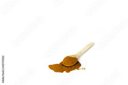 Wooden handmade teaspoon with a pinch of brown sugar
