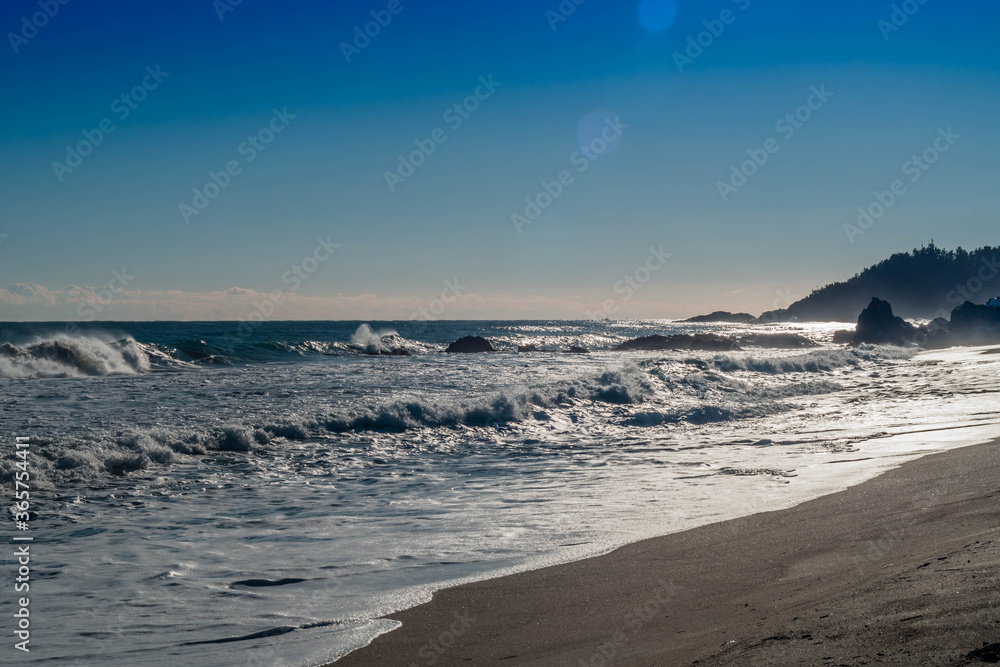 Ocean waves crashing onto beach