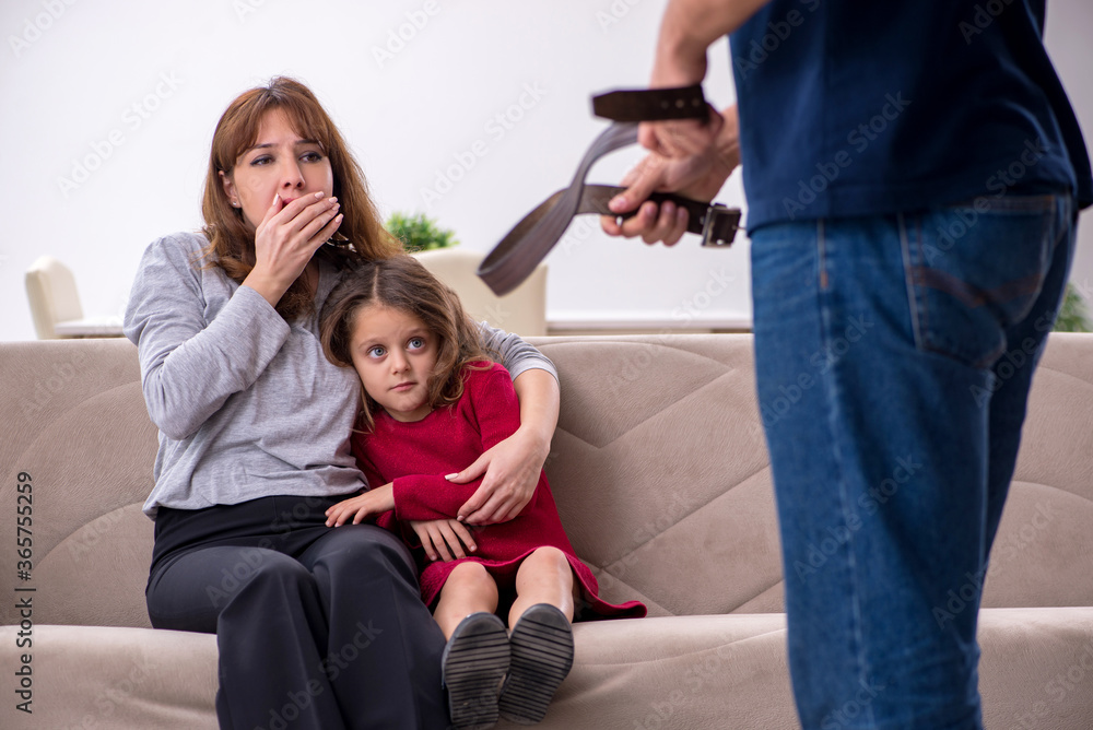 Young couple and their daughter in family conflict concept Young couple and their daughter in family conflict concept