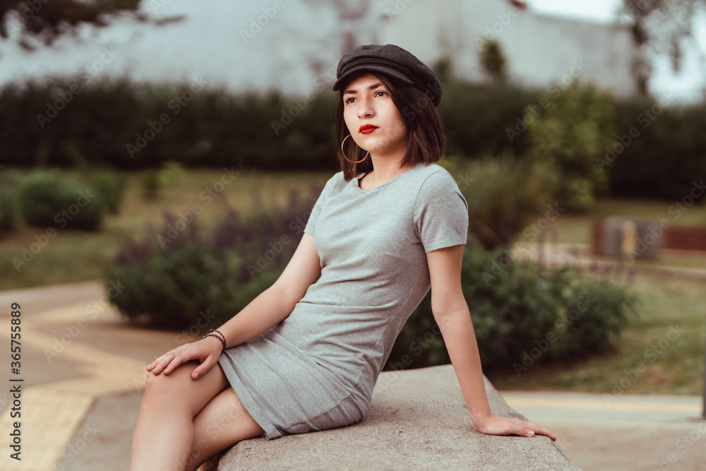 Beautiful teenager in a black hat with red full lips Beautiful teenager in a black hat with red full lips