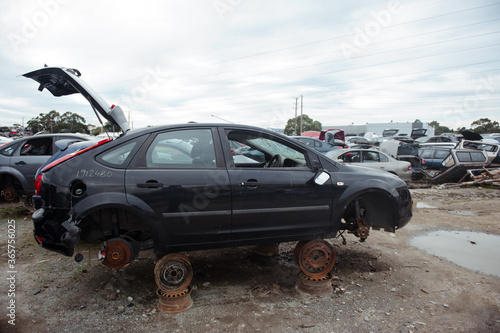 Melbourne, Victoria / Australia - July 18 2020: Old wrecked cars in junkyard. Car recycling.