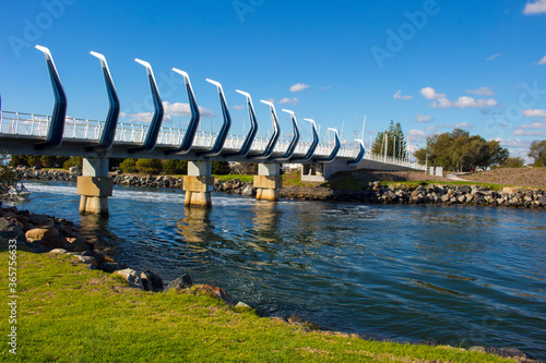 Approach to the new curved Koombana Bay Footbridge in Bunbury, Western Australia  with its maritime theme reinforces the importance of the water front to the City. photo