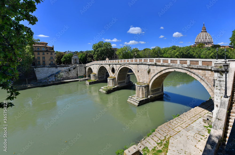 Rome, Sisto bridge with St. Peter dome at background