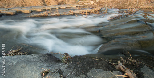 Closeup of a flowing river © aminkorea