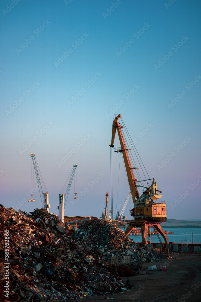 Garbage pile in trash dump or junkyard, metal crane garbage consumption junkyard scarp, Global warming, Ecosystem and environment concepts and background. Garbage pile in trash dump or junkyard, metal crane garbage consumption junkyard scarp, Global warming, Ecosystem and environment concepts and background.