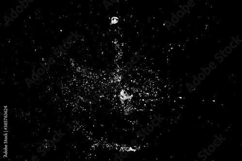 Splash of water in the dark for use in advertising images with screen mode.