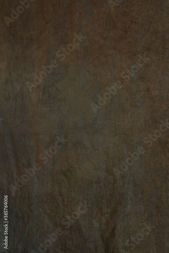 The texture of the popular fabric art background for portrait photography is green hue.