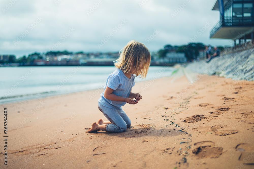 Preschooler boy playing on the beach Preschooler boy playing on the beach