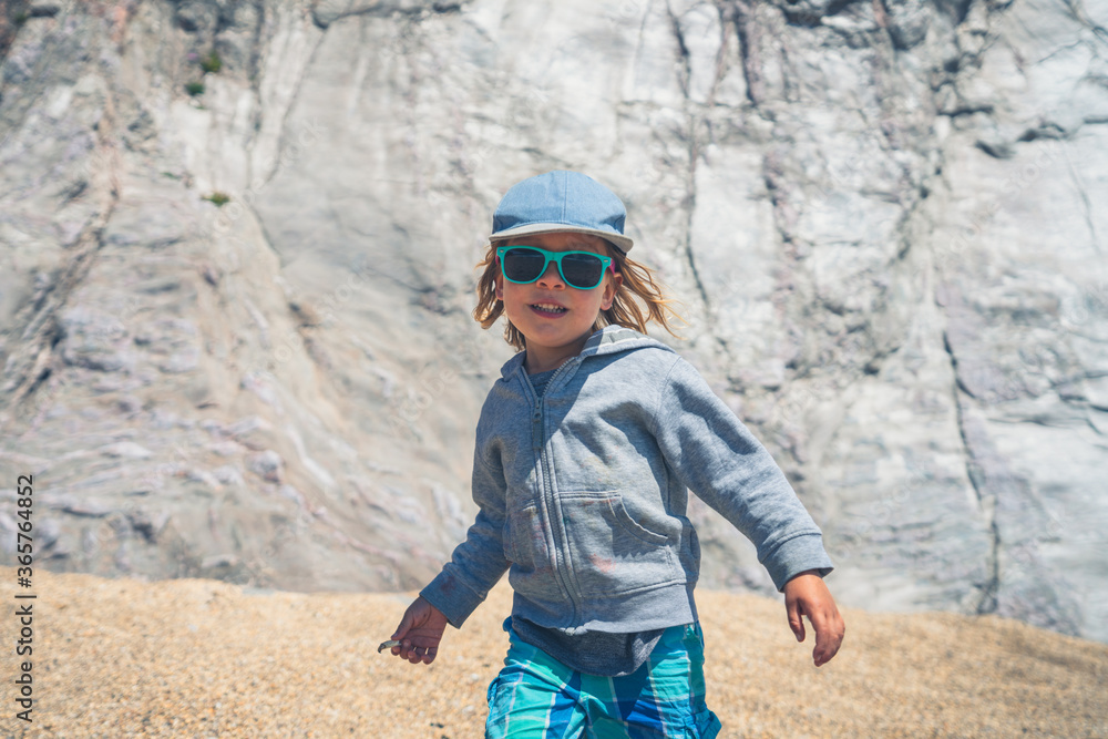 Preschooler boy wearing sunglasses on the beach Preschooler boy wearing sunglasses on the beach