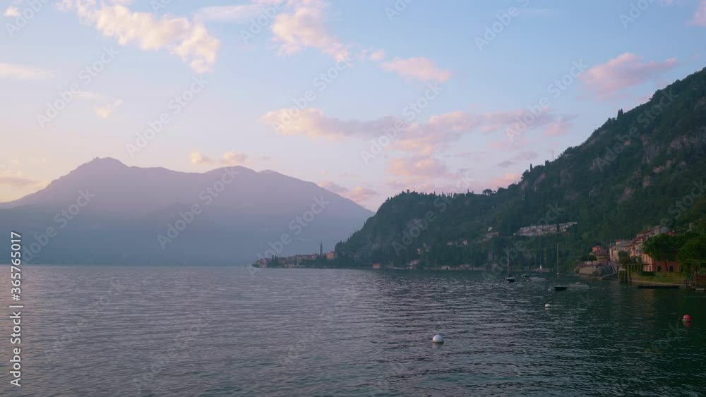Amazing mountain landscape of Como lake and village of Varenna in sunset time, Province of Lecco, Italy. Amazing mountain landscape of Como lake and village of Varenna in sunset time, Province of Lecco, Italy.