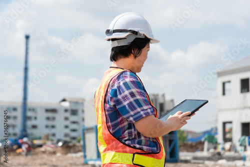 Woman construction engineer at construction site