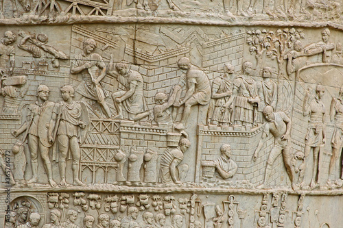Trajan's column on the streets of Rome showing exquisite carved detail of Roman workers