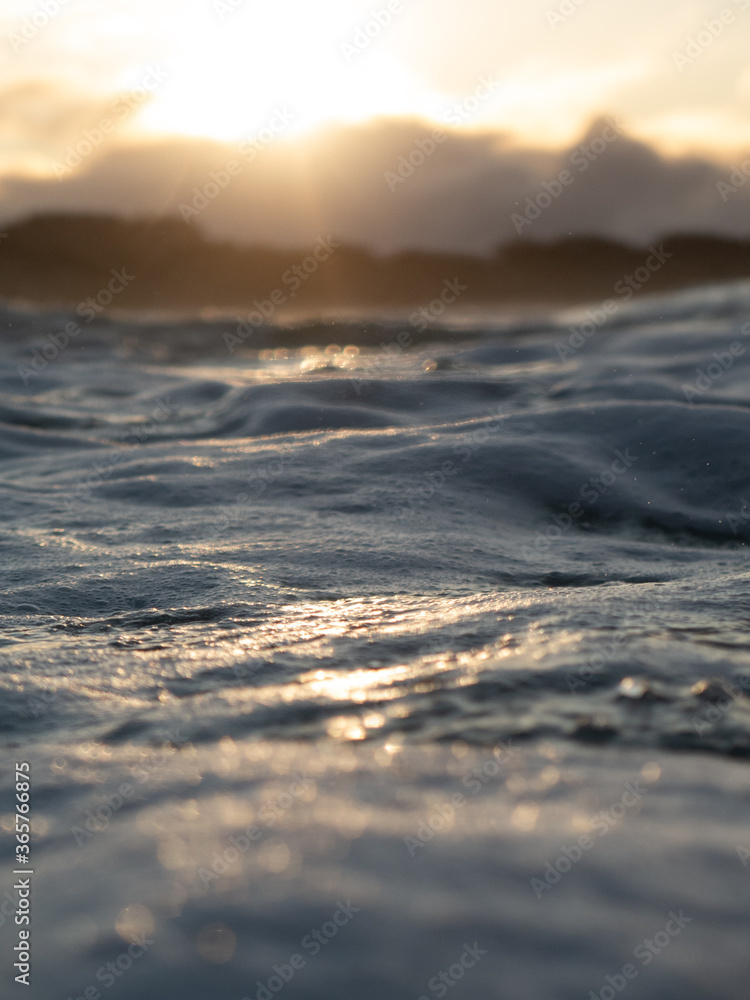 Abstract photo of waves breaking onto a sun drenched beach, New Zealand. Abstract photo of waves breaking onto a sun drenched beach, New Zealand.