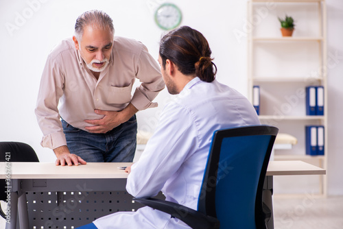 Old patient visiting young male doctor