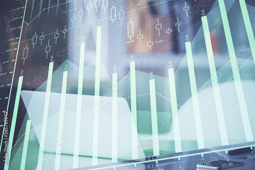 Forex graph hologram on table with computer background. Multi exposure. Concept of financial markets.