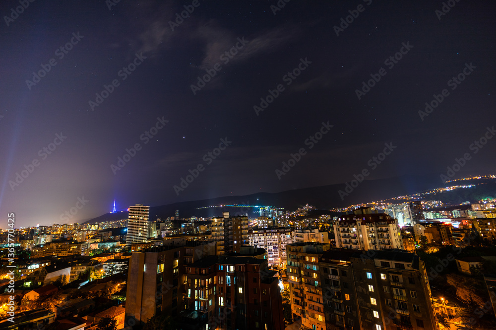 Night sky with stars over Tbilisi's downtown