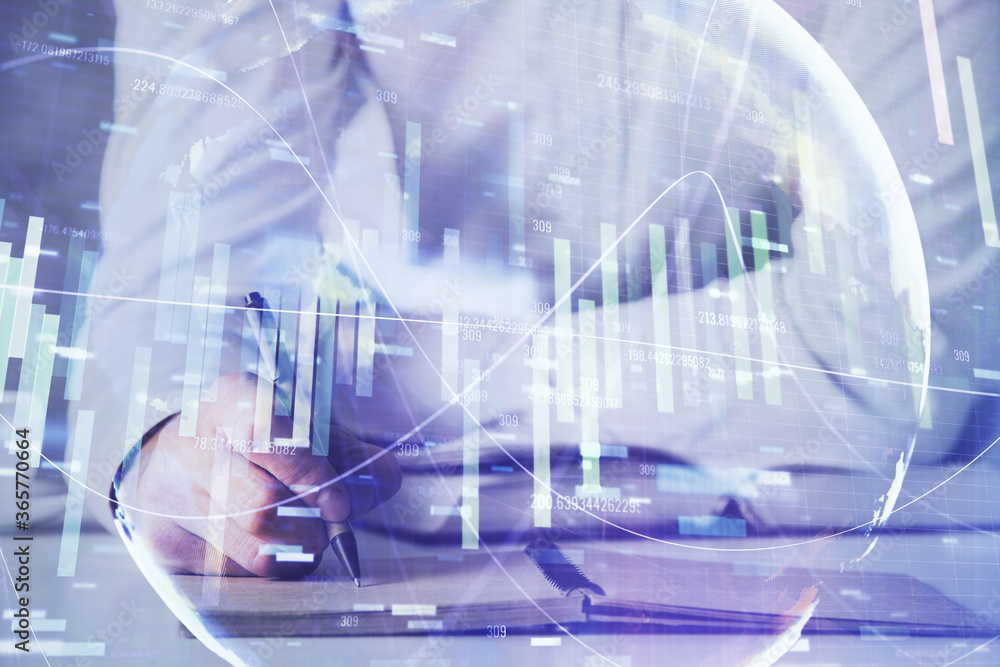 Double exposure of Man writing in notepad with business icons on background. Double exposure of Man writing in notepad with business icons on background.