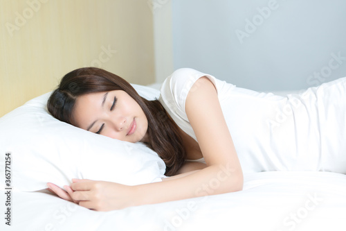 Pretty young girl sleeping in bedroom