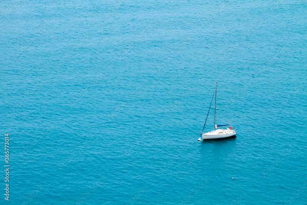 Alone yacht with anchored sail in the Mediterranean sea on vacation. Alone yacht with anchored sail in the Mediterranean sea on vacation.