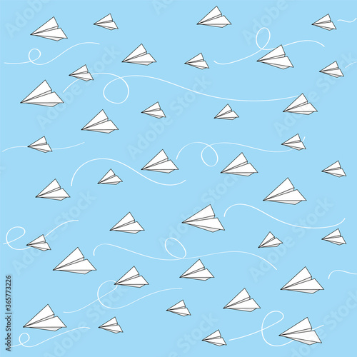 flying paper airplanes on a blue background