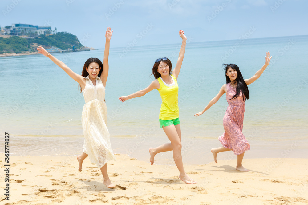 Pretty young girls  traveling together at seaside