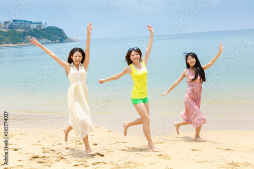 Pretty young girls traveling together at seaside