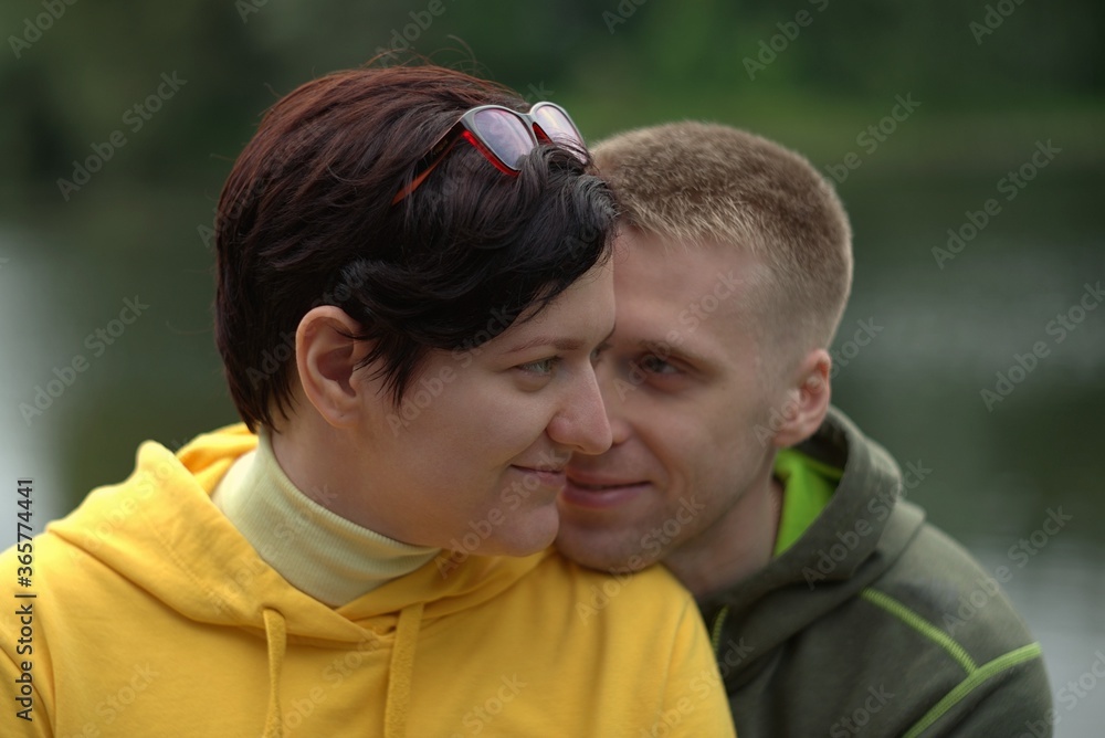 Couple of hugging man and woman in sportswear close up Couple of hugging man and woman in sportswear close up