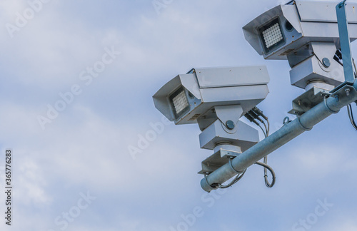 Speed radar cameras against blue sky