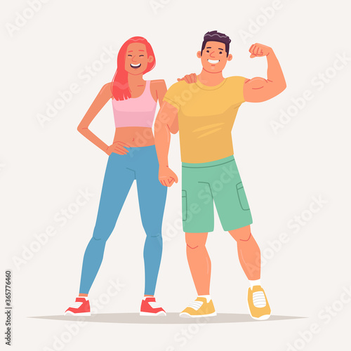 Happy couple of young people dressed in sportswear and leading an active lifestyle. Man and woman visitors to the gym