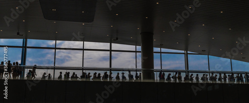 Silhouette of people standing in line