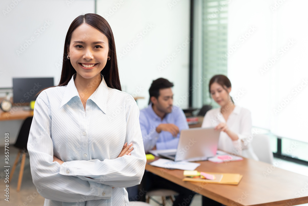 Confident business asian woman stand and cross arm in the office. Confident business asian woman stand and cross arm in the office.