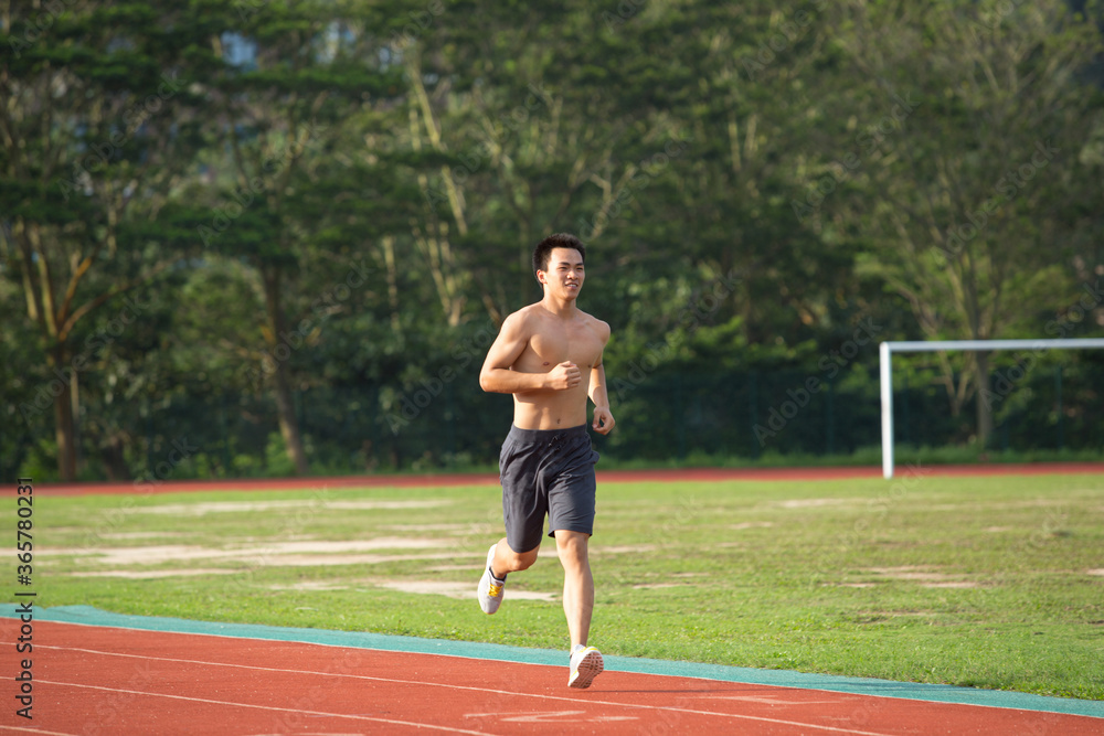 Young Asian man doing exercise outdoors Young Asian man doing exercise outdoors