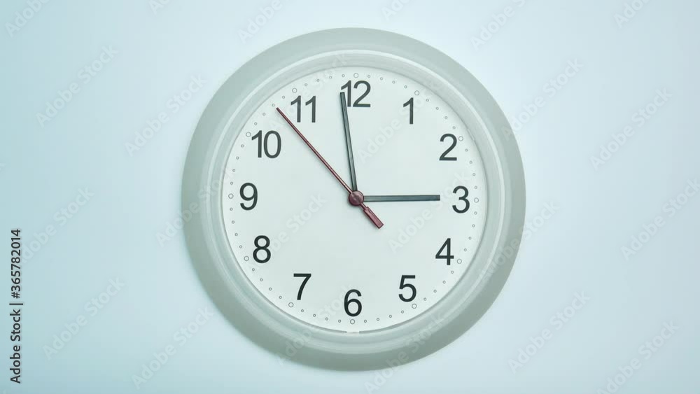 White clock isolated on white background Showtime 02.59 am or pm. White clock isolated on white background Showtime 02.59 am or pm.