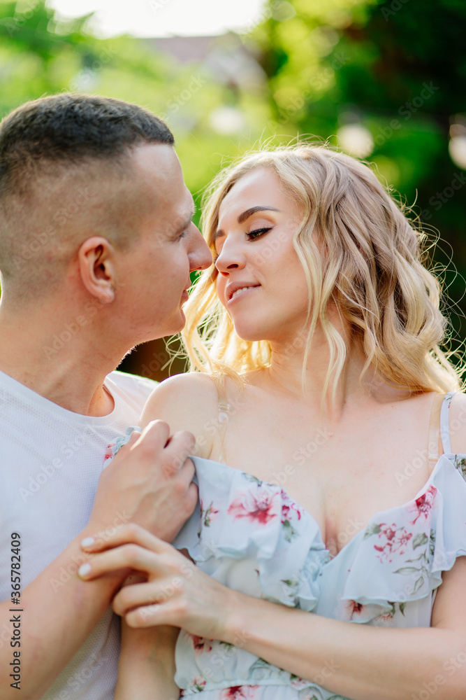 beautiful and happy couple having fun in garden.