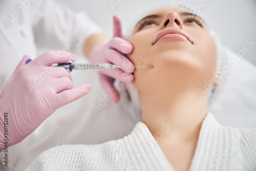 Face rejuvenation procedure by qualified beauty expert