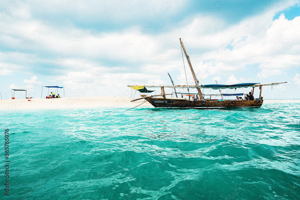 Boat near white sand bank in Zanzibar