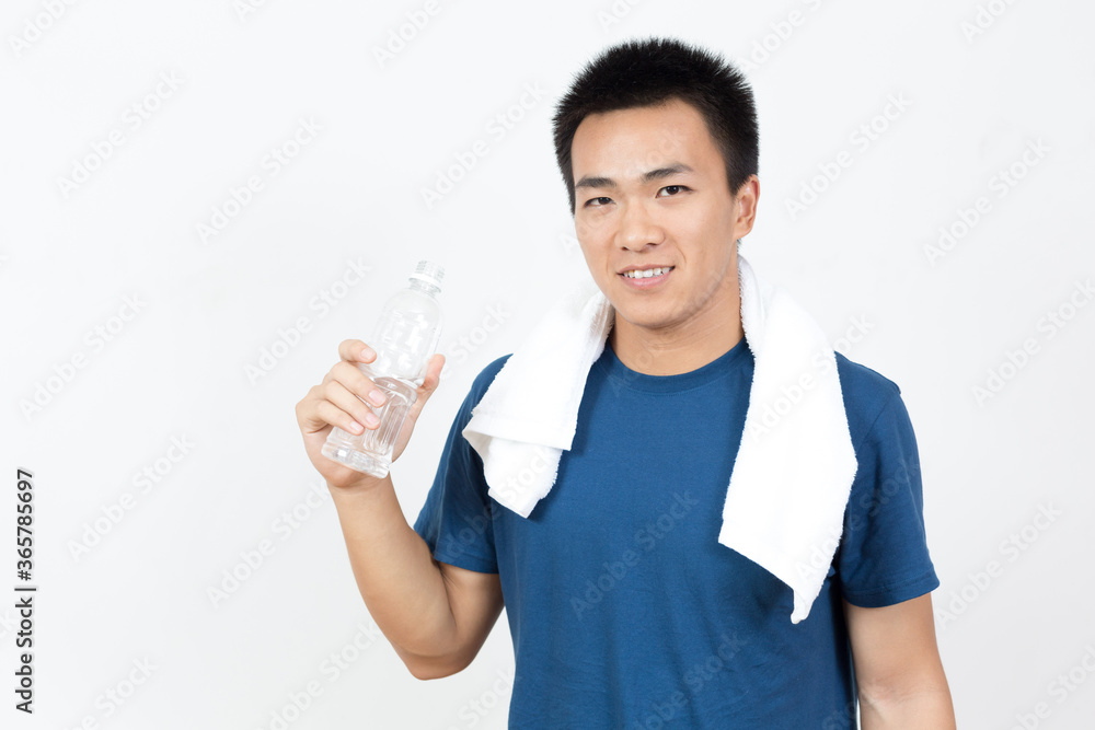 Young Asian man drinking water after sports Young Asian man drinking water after sports