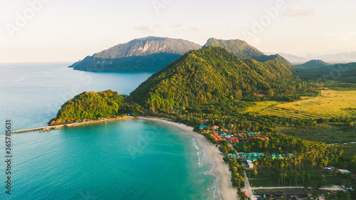 Beach and Sea and mountain  Top View , Wave of Turquoise ocean water on sandy beach, Aerial top view of Khanom beach, Khanom, Nakhon Si Thammarat Thailand photo