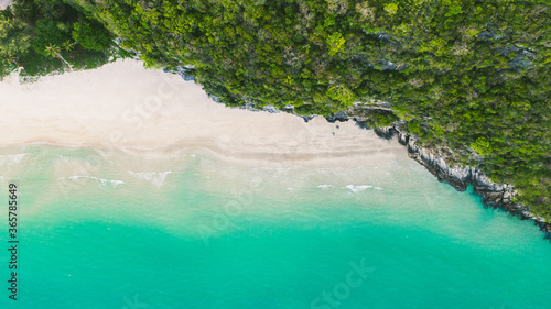 ฺBeautiful Top View, Wave of Turquoise ocean water on sandy beach, High angle view sea and sand background, Aerial top view of Khanom beach, Khanom, Nakhon Si Thammarat Thailand photo