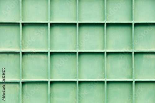 Old green metal cell panels texture closeup