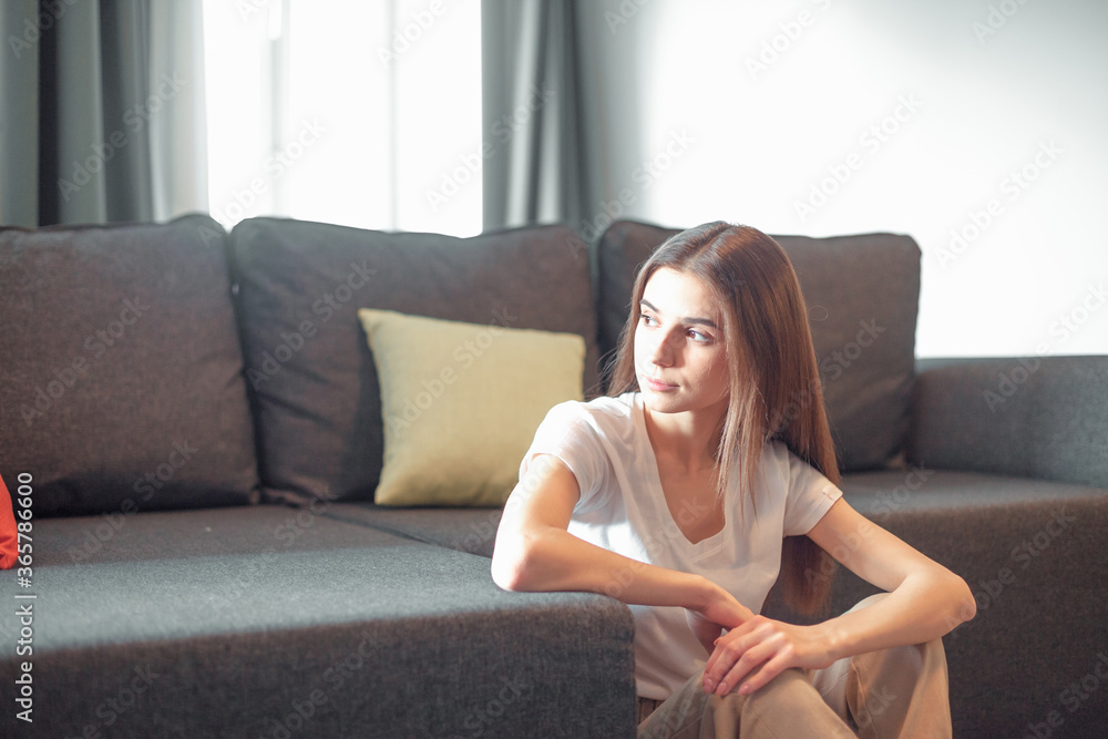 Young woman pretty relaxing on couch in living room Young woman pretty relaxing on couch in living room