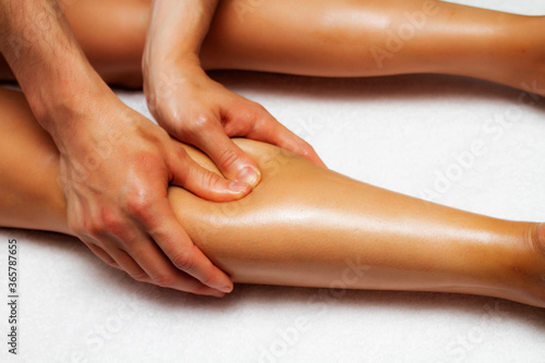 Lymphatic drainage massage of the calf muscles.