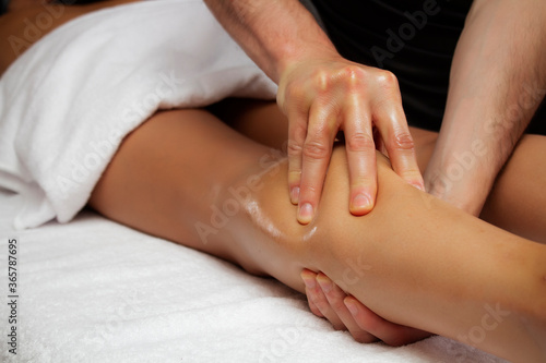 Lymphatic drainage massage of the calf muscles.