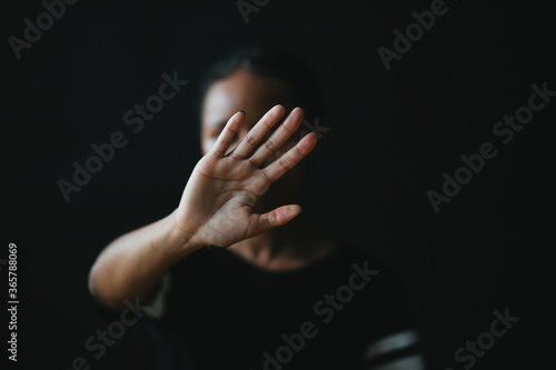 young woman with hands on her face
