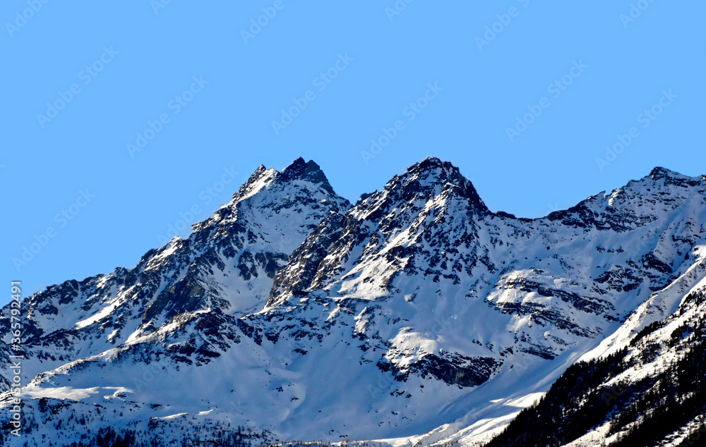 Dolomites mountains in Bormio region on sunny winter day in Bormio, Italy.