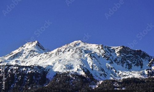 Dolomites mountains in Bormio region on sunny winter day in Bormio, Italy.