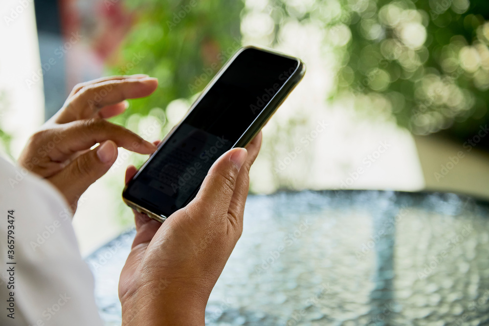 Asian woman using mobile smart phone