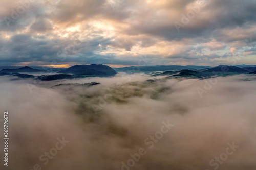 beautiful landscape with valleys, lakes and rivers in fog